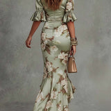 Dearbhla - Asymmetrical long dress in green with V-neck, flared puff sleeves, and floral pattern