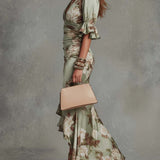 Dearbhla - Asymmetrical long dress in green with V-neck, flared puff sleeves, and floral pattern